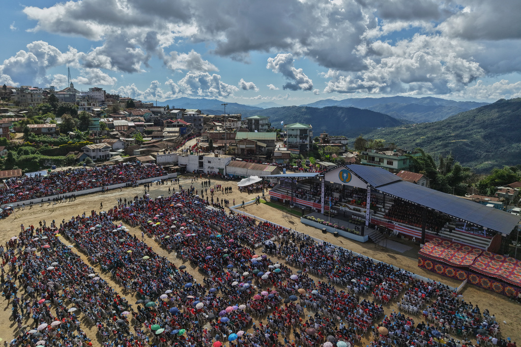 People wait for the arrival of Thuingaleng Muivah, leader of the National Socialist Council of Nagaland (Isak-Muivah), in Ukhrul, in the northeastern Indian state of Manipur, Wednesday, Oct. 22, 2025. (AP Photo/Anupam Nath)