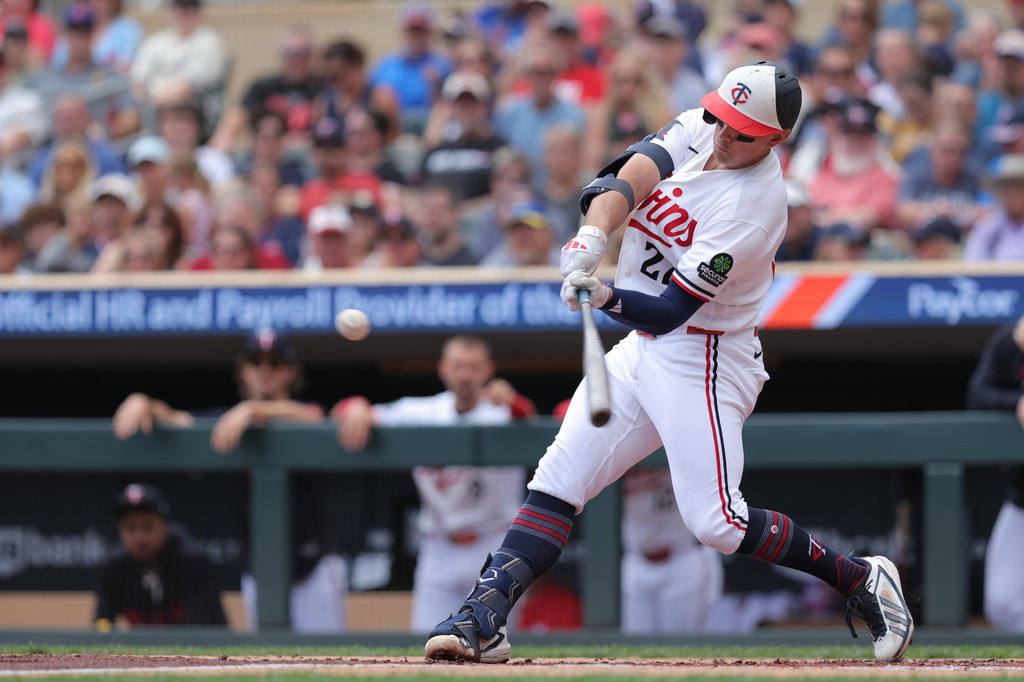 Minnesota Twins' Brooks Lee hits a grand slam during the first inning of a baseball game against the Philadelphia Phillies, Sunday, Aug. 16, 2026, in Minneapolis. (AP Photo/Bailey Hillesheim)