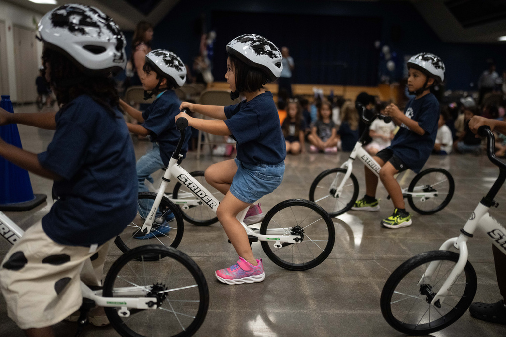 Students participate in a learn-to-ride program at Terra Vista Elementary School in Rancho Cucamonga, Calif., Wednesday, Sept. 2, 2026.(AP Photo/Jae C. Hong)