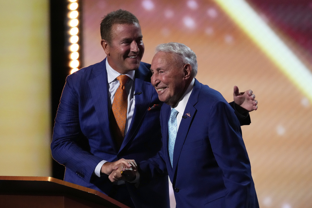 FILE - Kirk Herbstreit, left, greets Lee Corso on stage at the ESPY Awards at the Dolby Theatre in Los Angeles, July 16, 2025. (AP Photo/Mark J. Terrill, File)
