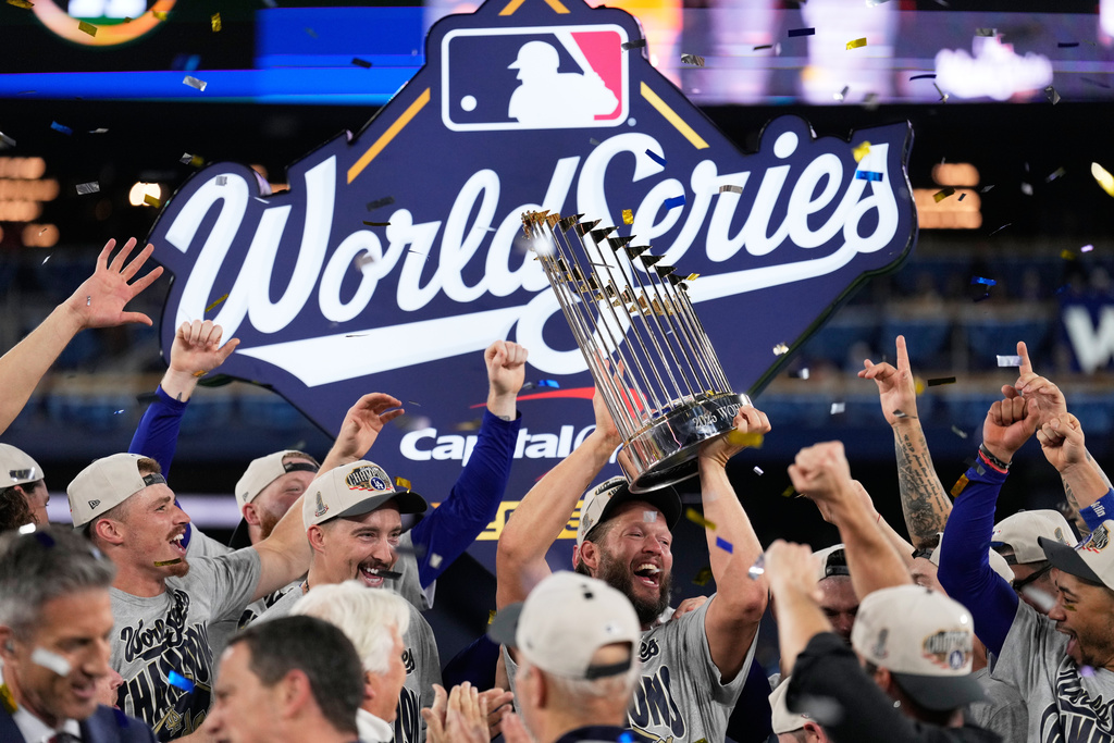 Los Angeles Dodgers pitcher Clayton Kershaw celebrates with the trophy after their win against the Toronto Blue Jays in Game 7 of baseball's World Series, Sunday, Nov. 2, 2025, in Toronto. (AP Photo/Brynn Anderson)