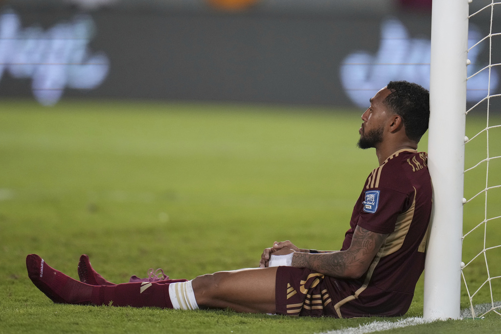 Venezuela's Jose Martínez sits after a World Cup 2026 qualifying loss to Colombia in Maturín, Venezuela, Tuesday, Sept. 9, 2025. (AP Photo/Ariana Cubillos)