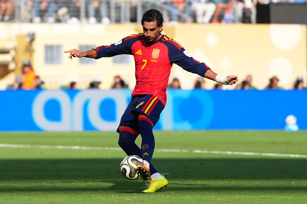 Spain's Ferran Torres (7) scores their first goal during the World Cup final soccer match between Spain and Argentina in East Rutherford, N.J., near New York, Sunday, July 19, 2026. (AP Photo/Julio Cortez)