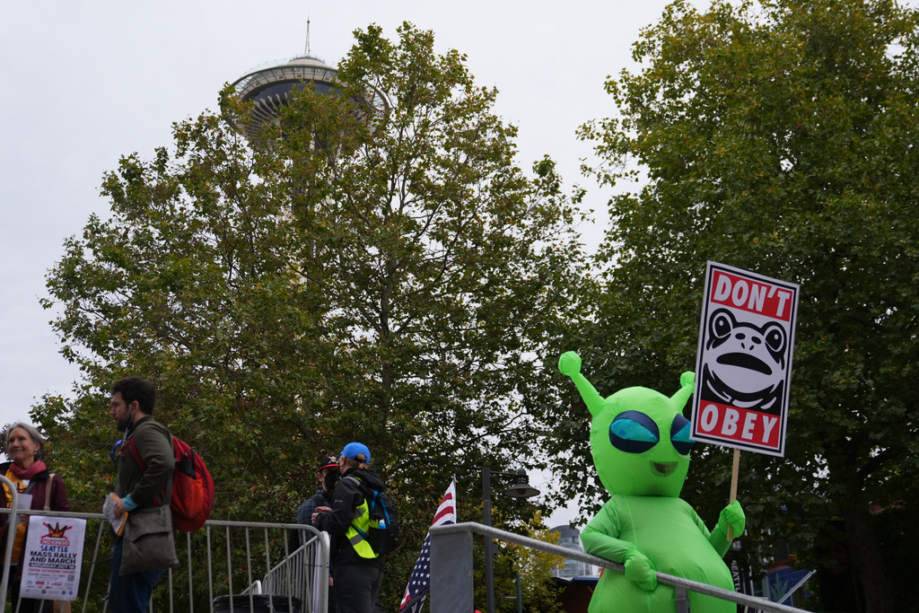 People take part in a "No Kings" protest Saturday, Oct. 18, 2025, in Seattle. (AP Photo/Lindsey Wasson)