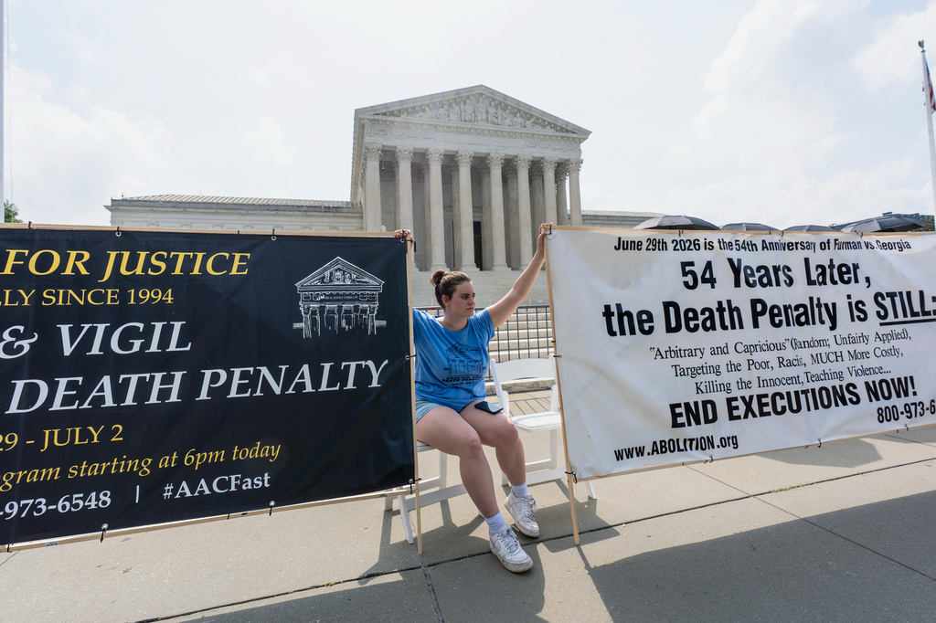 Activists and demonstrators wait outside the Supreme Court for the Justices to release opinions, in Washington, Monday, June 29, 2026. (AP Photo/J. Scott Applewhite)