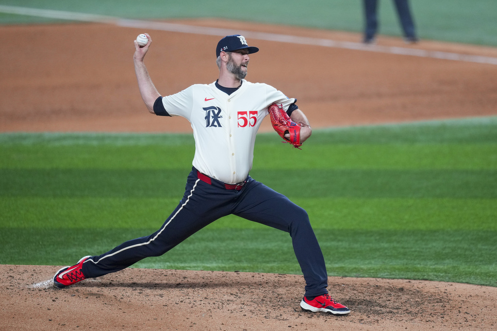 Texas Rangers pitcher Chris Martin throws to the Miami Marlins during the sixth inning of a baseball game Friday, Sept. 19, 2025, in Arlington, Texas. (AP Photo/Julio Cortez)