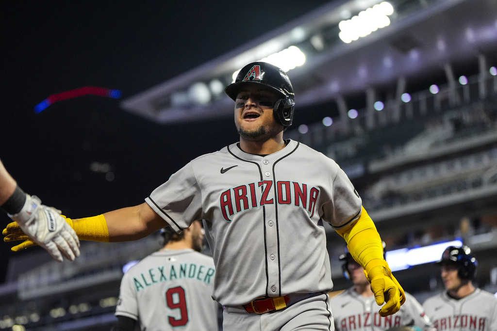 Arizona Diamondbacks' Gabriel Moreno (14) celebrates his three-run homer in the nineth inning of a baseball game against the Minnesota Twins, Friday, Sept. 12, 2025, in Minneapolis. (AP Photo/Mike Stewart)