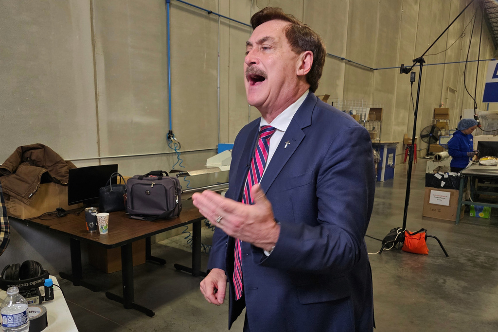 MyPillow CEO and founder Mike Lindell speaks to reporters at his MyPillow factory in the Minneapolis suburb of Shakopee, Minn., on Thursday, Dec, 11, 2025, as he launches his campaign for the Republican nomination to challenge Democratic Minnesota Gov. Tim Walz in 2026. (AP Photo/Steve Karnowski)