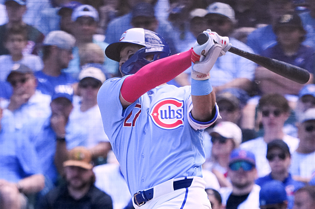 Chicago Cubs' Seiya Suzuki hits a two-run double during the first inning of a baseball game Friday, June 19, 2026, in Chicago. (AP Photo/David Banks)