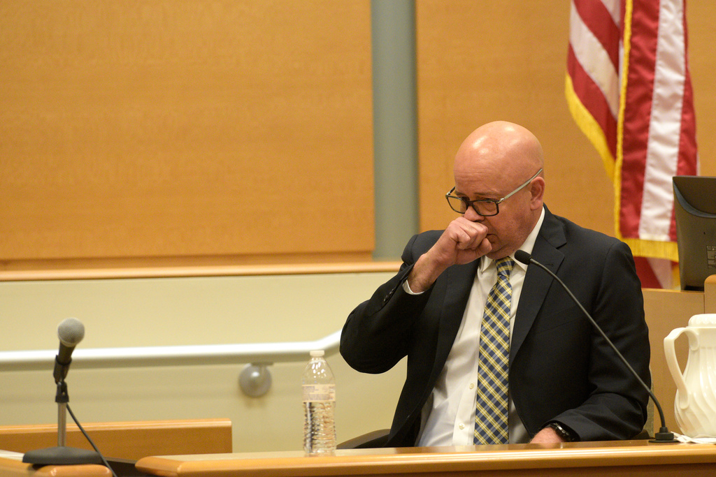FILE - FBI agent William Aldenberg tries to compose himself while testifying during the first day of Alex Jones' Sandy Hook defamation damages trial at Waterbury Superior Court, Sept. 13, 2022, in Waterbury, Conn. (H John Voorhees III/Hearst Connecticut Media via AP, File)