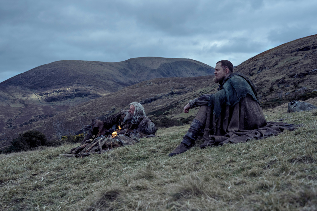 This image released by A24 shows Hugh Jackman, left, and Bill Skarsgård in a scene from "The Death of Robin Hood." (Aidan Monaghan/A24 via AP)