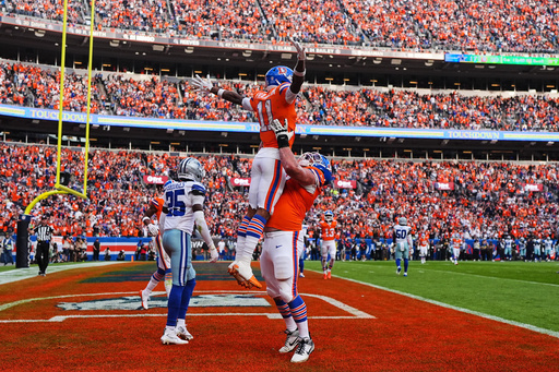 Denver Broncos' Garett Bolles, right, lifts Troy Franklin (11) as they celebrate Franklin's touchdown catch as Dallas Cowboys' Trikweze Bridges (25) walks away in the second half of an NFL football game Sunday, Oct. 26, 2025, in Denver. (AP Photo/Jack Dempsey) Denver Broncos' Garett Bolles, right, lifts Troy Franklin (11) as they celebrate Franklin's touchdown catch as Dallas Cowboys' Trikweze Bridges (25) walks away in the second half of an NFL football game Sunday, Oct. 26, 2025, in Denver. (AP Photo/Jack Dempsey)