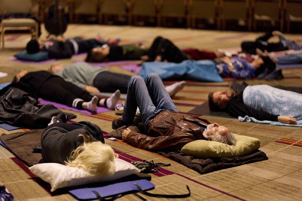 FILE - People partake in a sound bath at Temple Emanuel, Dec. 6, 2025, in Beverly Hills, Calif. (AP Photo/Allison Dinner, File)