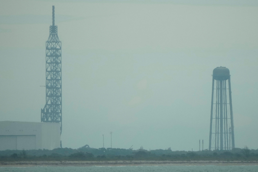 A lightning arrester and a charred water tower are seen at pad 36 in the aftermath of the Blue Origin New Glenn rocket explosion at the Cape Canaveral Space Force Station, Friday, May 29, 2026, in Cape Canaveral, Fla. (AP Photo/John Raoux)