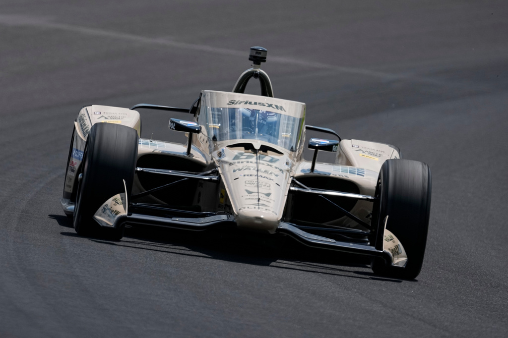 Felix Rosenqvist, of Sweden, drives through the third turn during qualifications for the Indianapolis 500 auto race at the Indianapolis Motor Speedway in Indianapolis, Sunday, May 17, 2026. (AP Photo/Michael Conroy)