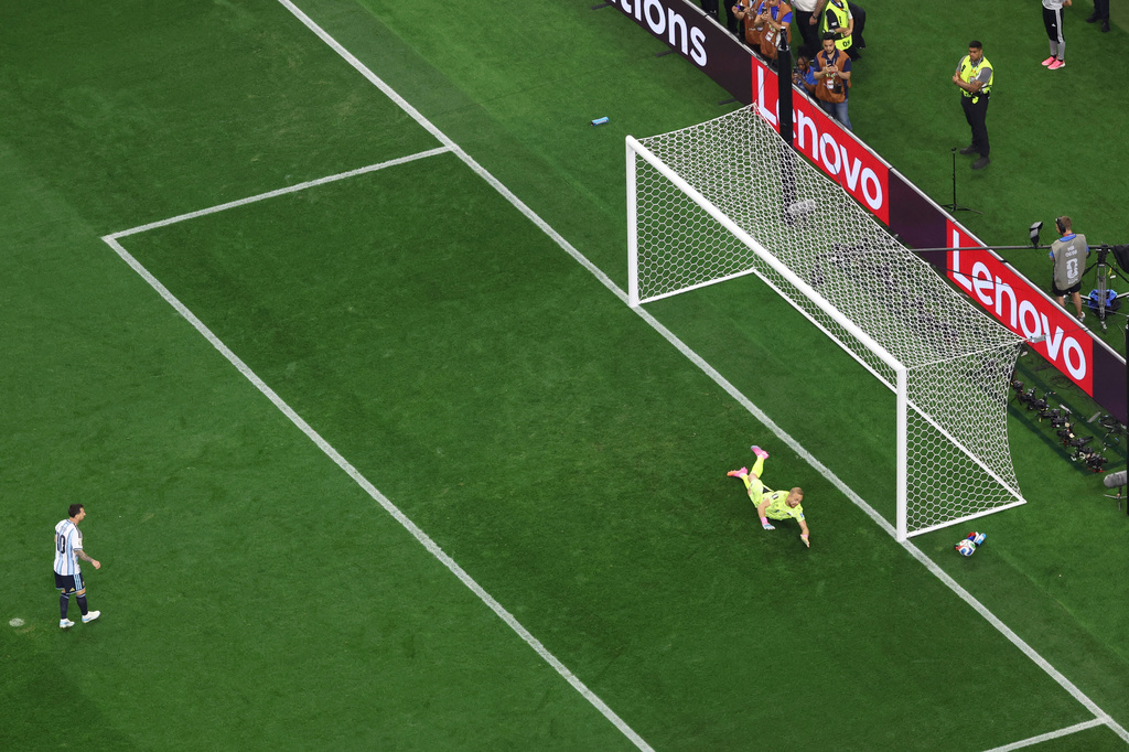 Austria goalkeeper Alexander Schlager (1) dives for the ball as Argentina's Lionel Messi's shot goes wide during the World Cup Group J soccer match between Argentina and Austria in Arlington, Texas, near Dallas, Monday, June 22, 2026. (AP Photo/Sam Hodde)