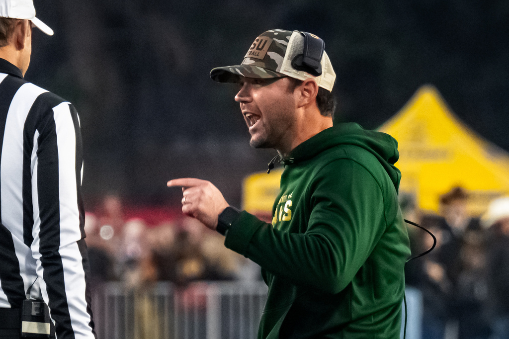 FILE - Colorado State interim head coach Tyson Summers speaks to the officials during an NCAA college football game against Wyoming on Saturday, Oct. 25, 2025, in Laramie, Wyo. (Milo Gladstein /The Wyoming Tribune Eagle via AP)/The Wyoming Tribune Eagle via AP, File)