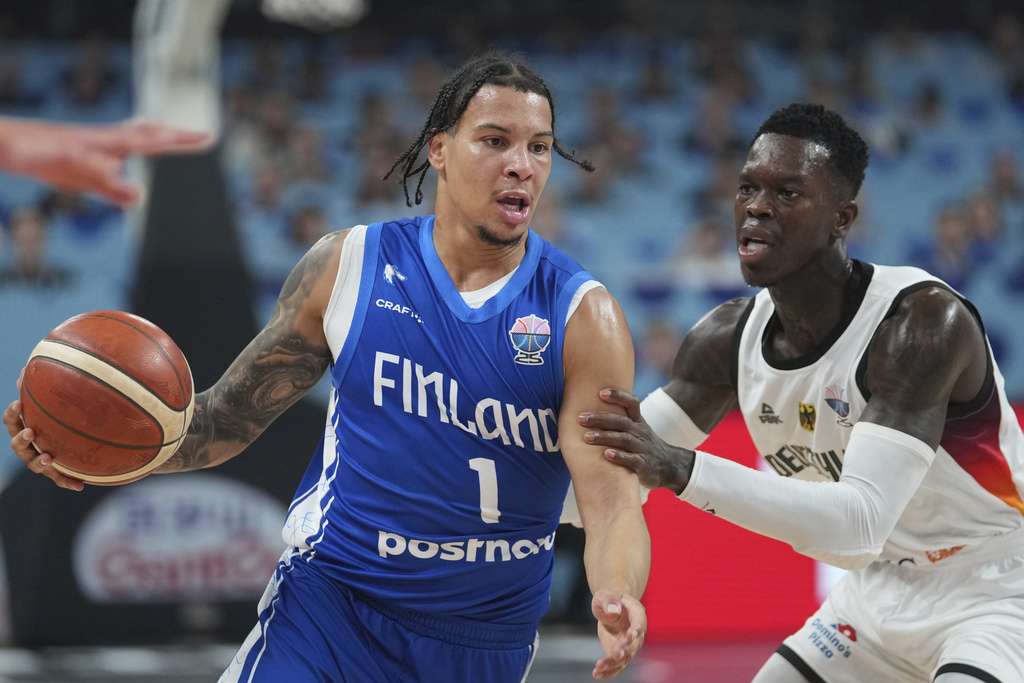 Finland's Miro Little, left, and Germany's Dennis Schroder in action during the Eurobasket, European Basketball Championship semi-final match between Germany and Finland at the Riga Arena in Riga, Latvia, Friday, Sept. 12, 2025. (AP Photo/Sergei Grits)