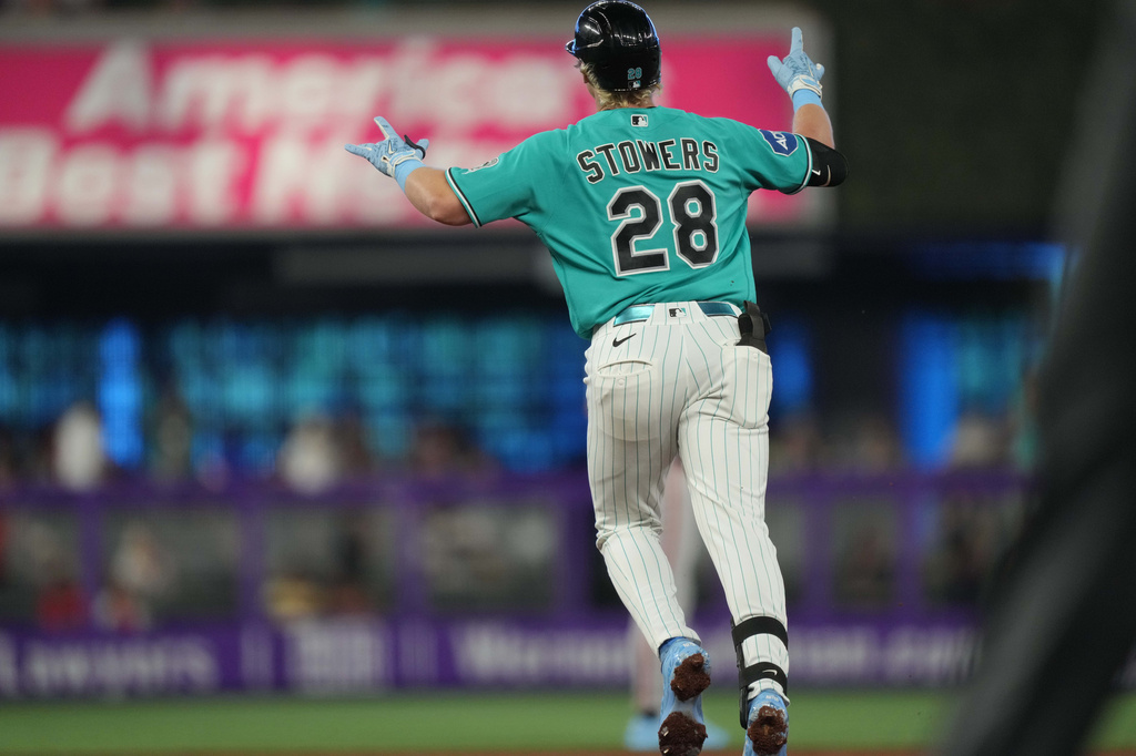 Miami Marlins' Kyle Stowers runs the bases and celebrates after hitting a home run during the second inning of a baseball game against the San Francisco Giants, Sunday, June 21, 2026, in Miami. (AP Photo/Jim Rassol)