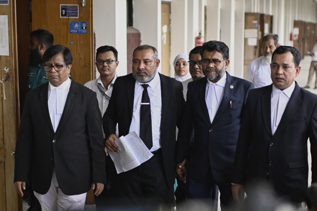 Public Prosecutor Muhammad Tariqul Islam, wearing a necktie, steps out during a break in proceedings in the corruption case against former British Minister Tulip Siddiq at the Dhaka Special Judge Court-4, in Dhaka, Bangladesh, Wednesday, Aug. 13, 2025. (AP Photo/Mahmud Hossain Opu)