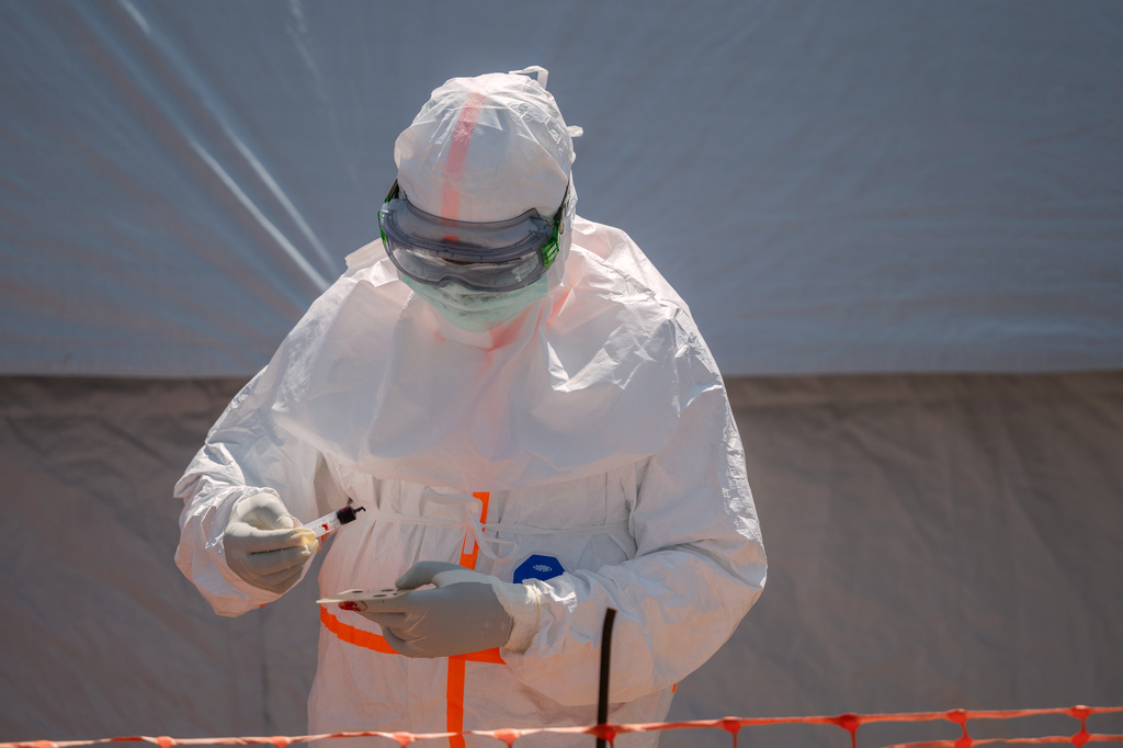FILE - A health worker prepares a patient's blood sample for testing at Bunia General Hospital in Bunia, Congo, Thursday, June 11, 2026. (AP Photo/Moses Sawasawa, File)