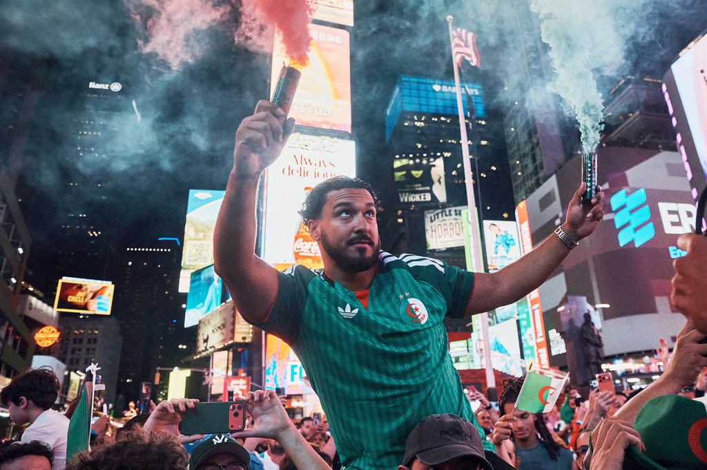 Algerian fans take part in a pre-match rally in support of the Algerian national soccer team in Times Square, Monday, June 15, 2026, in New York. (AP Photo/Andres Kudacki)