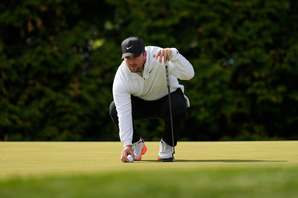 Chris Gotterup lines up his ball on the 12th green during the second round of the PGA Championship golf tournament at Aronimink Golf Club, Friday, May 15, 2026, in Newtown Square, PA. (AP Photo/Carolyn Kaster)