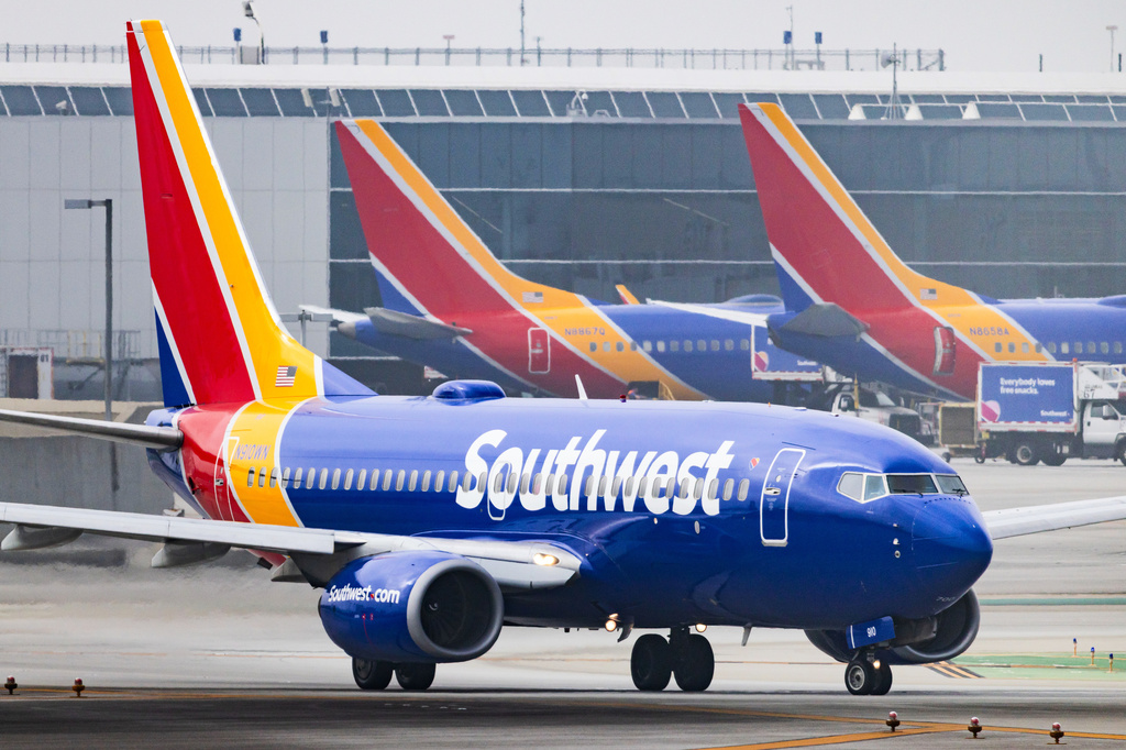 FILE - A Southwest Airlines plane is on the runway at Los Angeles International Airport on March 23, 2026, in Los Angeles. (AP Photo/Ethan Swope, File)