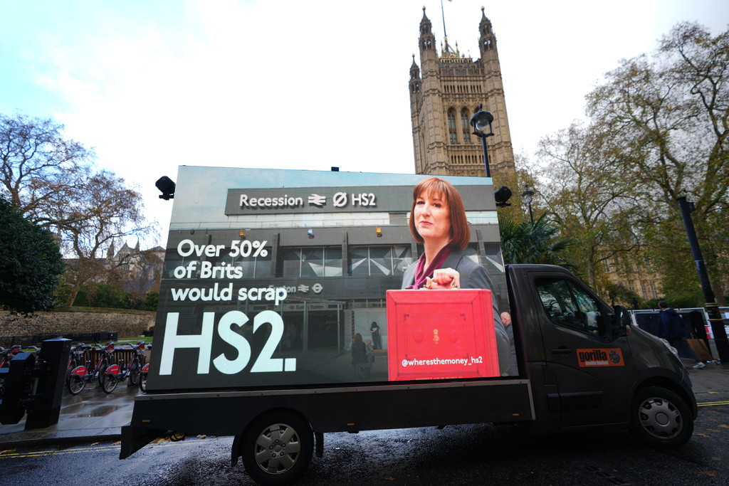 A van displays an electronic screen showing Britain's Chancellor Rachel Reeves ahead of Wednesday's Autumn Budget, in London, Monday, Nov. 24, 2025. (AP Photo/Kirsty Wigglesworth)