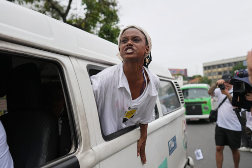 A woman protests days after a deadly police operation targeting a drug trafficking gang at the Complexo da Penha favela in Rio de Janeiro, Friday, Oct. 31, 2025. (AP Photo/Silvia Izquierdo) A woman protests days after a deadly police operation targeting a drug trafficking gang at the Complexo da Penha favela in Rio de Janeiro, Friday, Oct. 31, 2025. (AP Photo/Silvia Izquierdo)