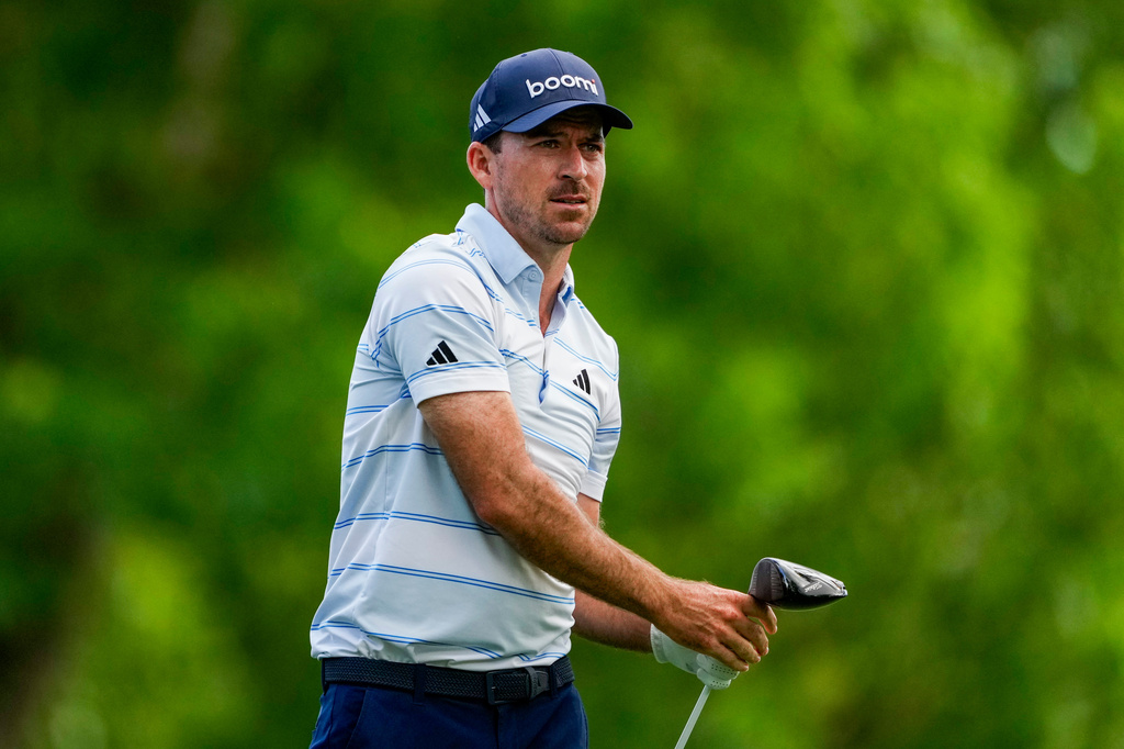 Nick Taylor, of Canada, hits from the 18th tee during first round of the Truist Championship golf tournament at the Quail Hollow Club, Thursday, May 7, 2026, in Charlotte, N.C. (AP Photo/Chris Carlson)d