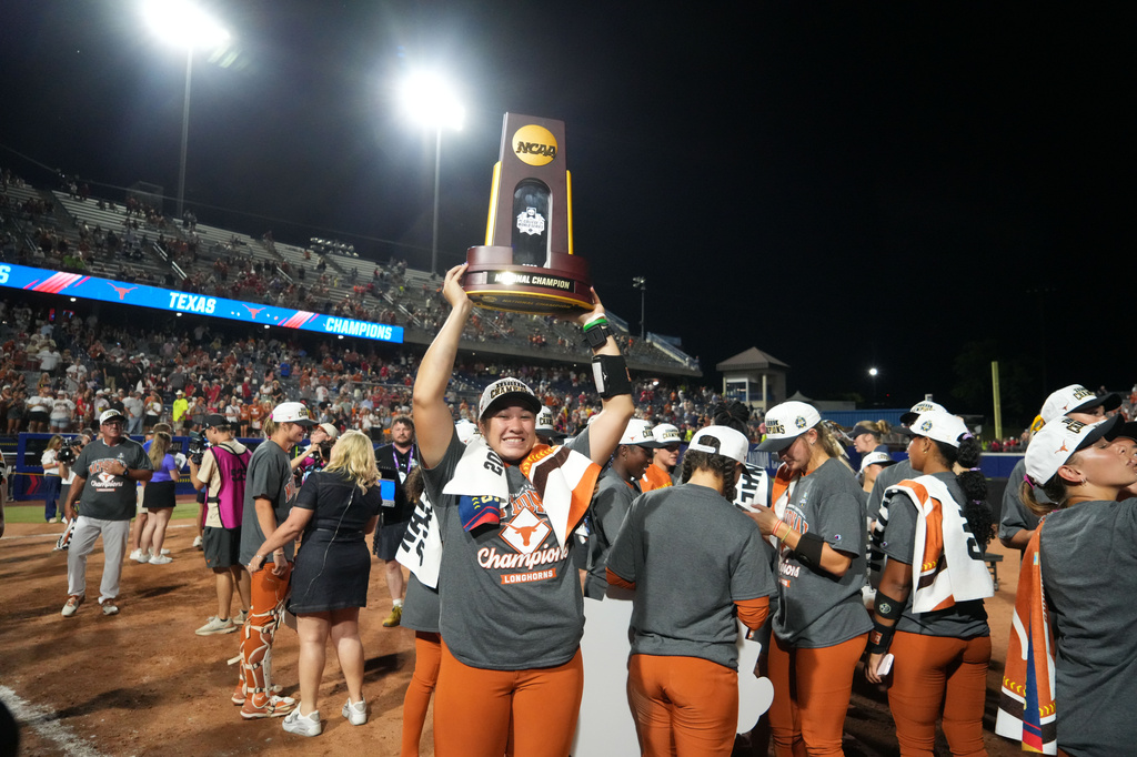 Texas' Katie Stewart celebrates after the team defeated Texas Tech to win the Women's College World Series softball championship in Oklahoma City, Thursday, June 4, 2026. (AP Photo/Kyle Phillips)