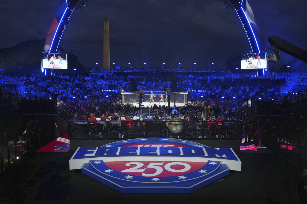 Featherweight fighters Diego Lopez and Steve Garcia in the ring during the first fight at UFC Freedom 250 on the South Lawn of the White House, Sunday, June 14, 2026, in Washington. (AP Photo/Julia Demaree Nikhinson)