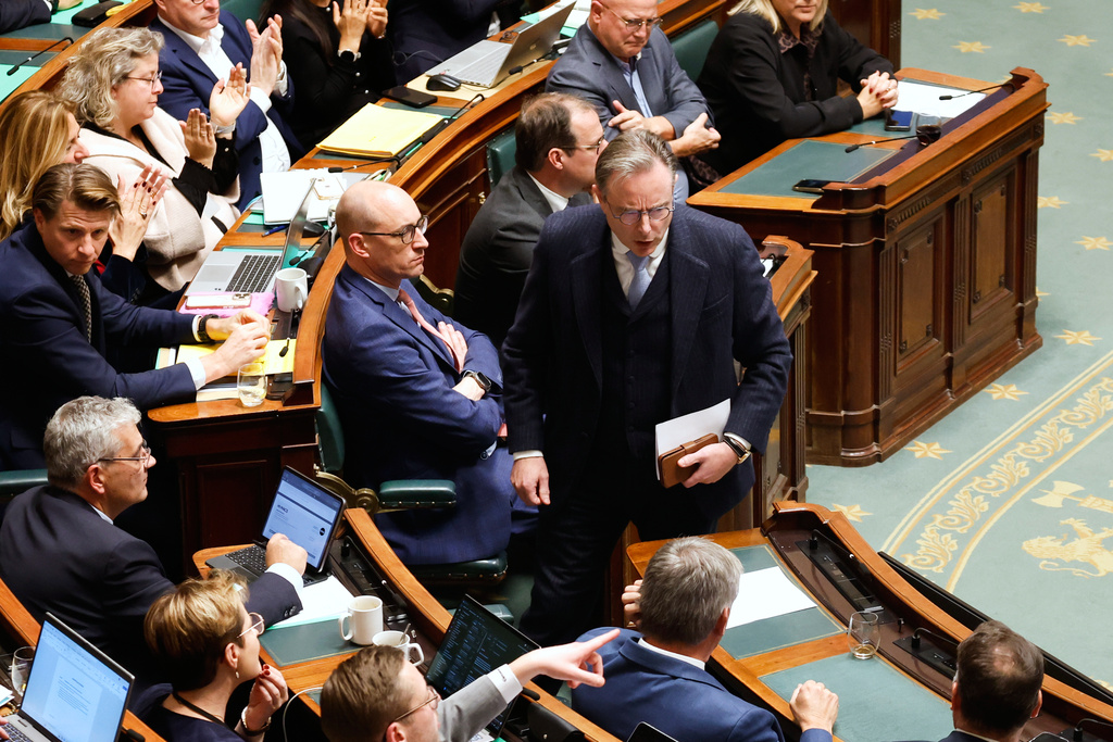 Belgium's Prime Minister Bart De Wever, center, prepares to take his seat after addressing the Belgian Parliament in Brussels, Belgium, Thursday, Nov. 6, 2025. (AP Photo/Geert Vanden Wijngaert)