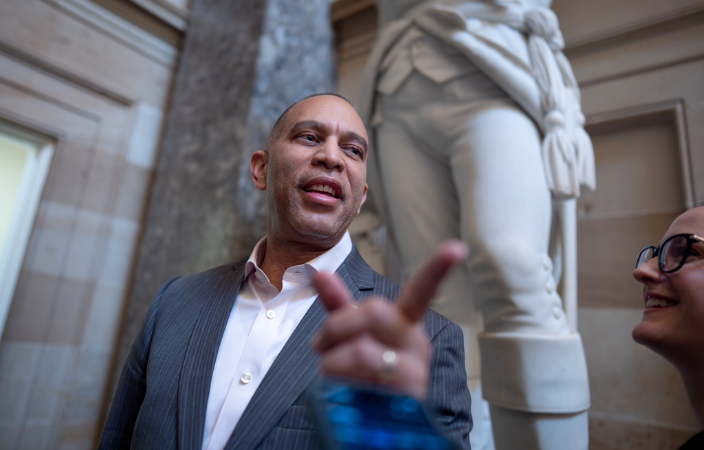 House Minority Leader Hakeem Jeffries, D-N.Y., responds to a reporter in Statuary Hall on day 24 of the government shutdown, at the Capitol in Washington, Friday, Oct. 24, 2025. (AP Photo/J. Scott Applewhite)
