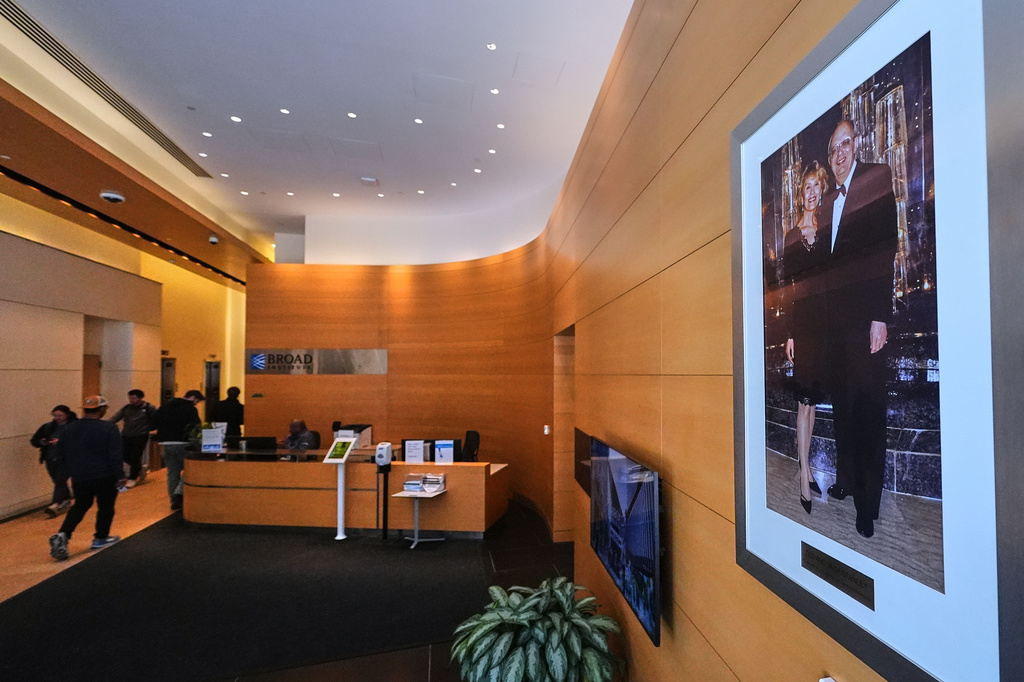 A portrait of Ted and Vada Stanley hangs in the lobby of the Broad Institute, which houses the Stanley Center for Psychiatric Research, Tuesday, March 17, 2026, in Cambridge, Mass. (AP Photo/Charles Krupa)