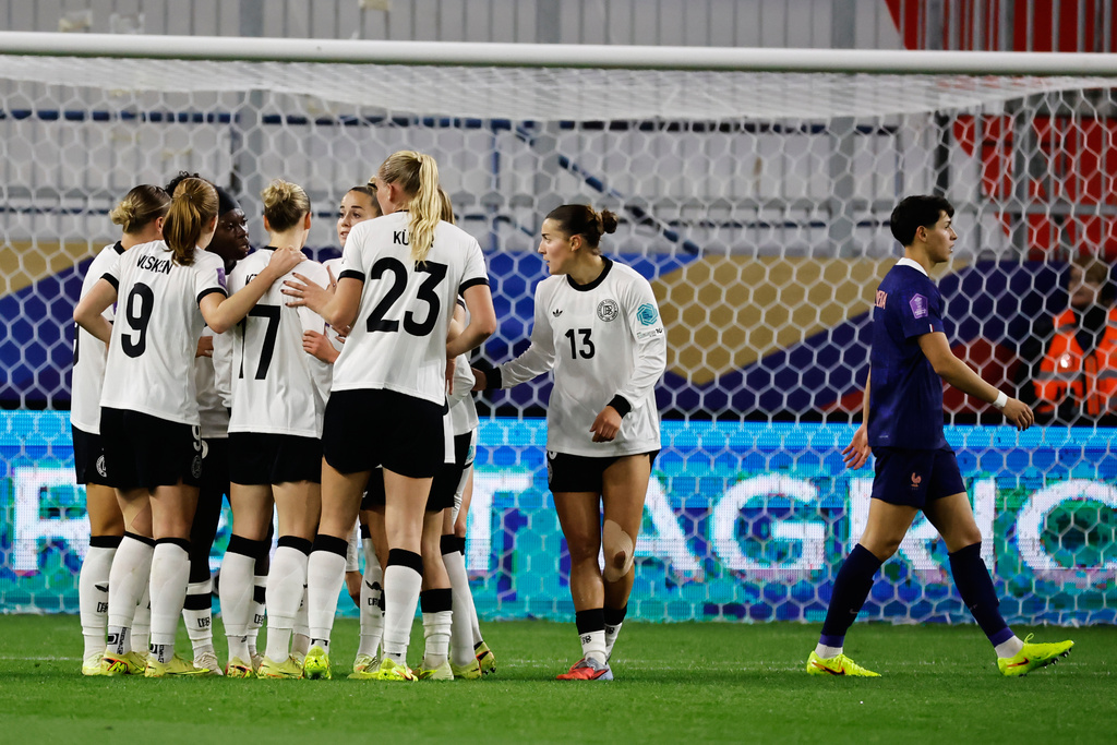Players celebrate after Germany's Nicole Anyomi scored her sides first goal during the women's Nations League semifinal second leg soccer match between France and Germany in Caen, France, Tuesday, Oct. 28, 2025. (AP Photo/Jeremias Gonzalez)