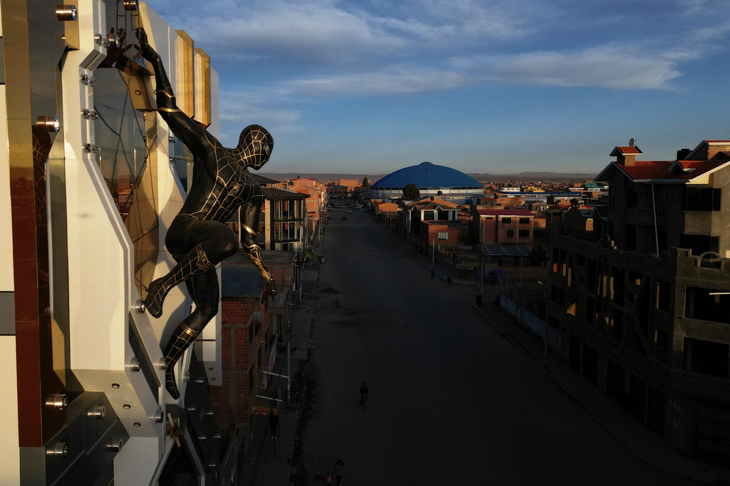 A Spiderman superhero statue decorates the Cholet building in El Alto, Bolivia, Tuesday, June 23, 2026. (AP Photo/Juan Karita)