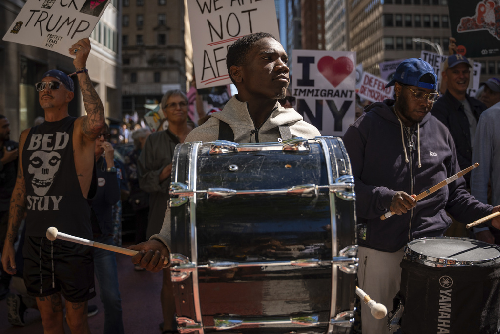 People march through Manhattan at the "Make Billionaires Pay" climate protest, Saturday, Sept. 20, 2025, in New York. (AP Photo/Angelina Katsanis)