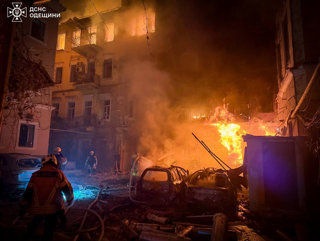 In this photo provided by the Ukrainian Emergency Service, emergency services personnel work to extinguish a fire of residential buildings following a Russian missiles attack in Odesa, Ukraine, Sunday, Aug. 9, 2026. (Ukrainian Emergency Service via AP)