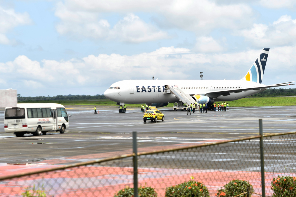 Plane carrying the deportees from the US arrives at the Roberts International Airport outside of Monrovia, Liberia, Thursday, Aug. 20, 2026. (AP Photo/Alexander Wiaplah)