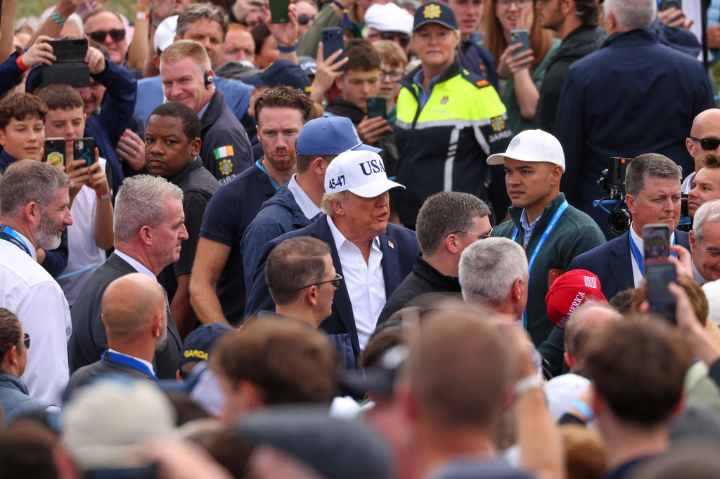 U.S. President Donald Trump makes his way through spectators as he attends the Irish Open at the Trump International Golf Links course in Doonbeg, Ireland, Sunday, Sept. 13, 2026.(AP Photo/Peter Morrison)