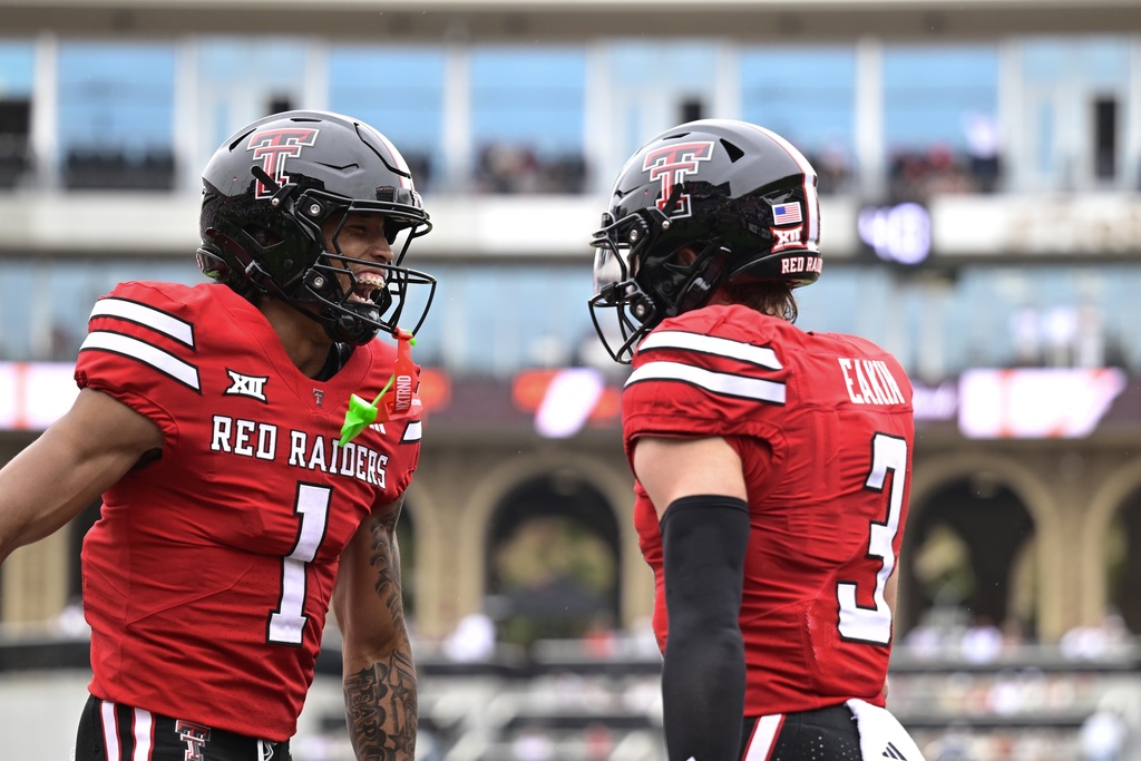 Texas Tech wide receivers Reggie Virgil (1) and Coy Eakin (3) celebrate Eakin's touchdown against Kent State during the first half of an NCAA college football game Saturday, Sept. 6, 2025, in Lubbock, Texas. (AP Photo/Justin Rex)