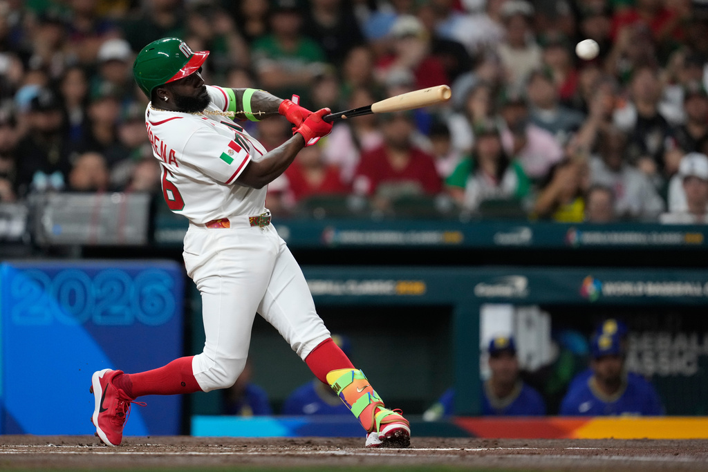 Mexico's Randy Arozarena doubles during the first inning of a World Baseball Classic game against Brazil, Sunday, March 8, 2026, in Houston. (AP Photo/Ashley Landis)