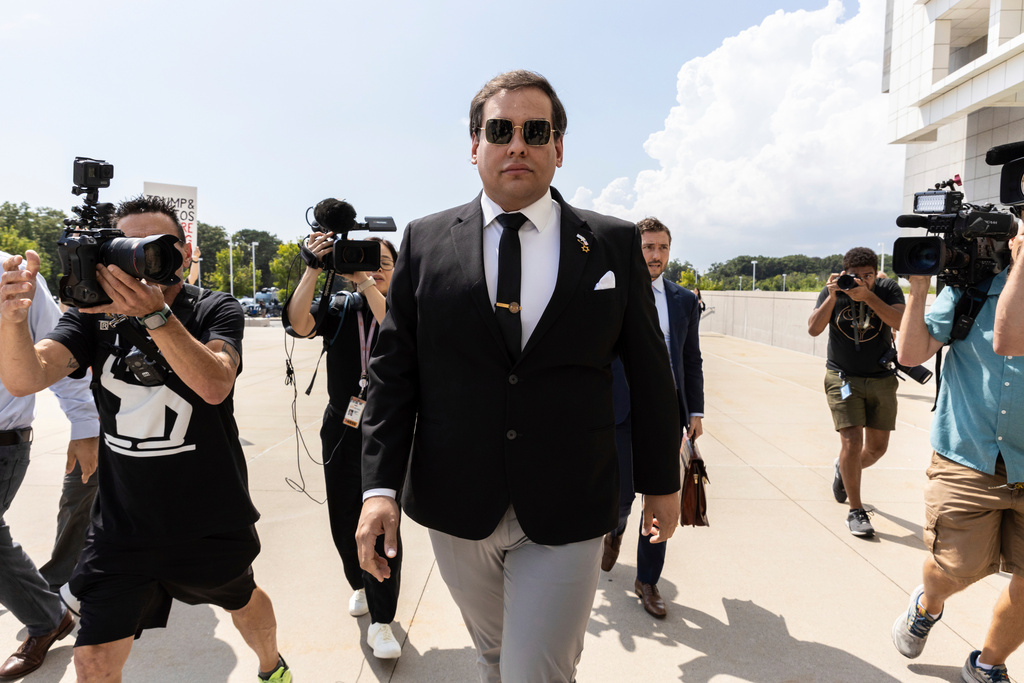 FILE - Former U.S. Rep. George Santos arrives at court in Central Islip, N.Y., Aug. 19, 2024. (AP Photo/Stefan Jeremiah, file)