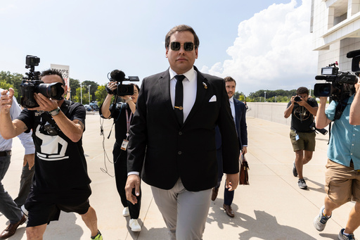 FILE - Former U.S. Rep. George Santos arrives at court in Central Islip, N.Y., Aug. 19, 2024. (AP Photo/Stefan Jeremiah, file) FILE - Former U.S. Rep. George Santos arrives at court in Central Islip, N.Y., Aug. 19, 2024. (AP Photo/Stefan Jeremiah, file)