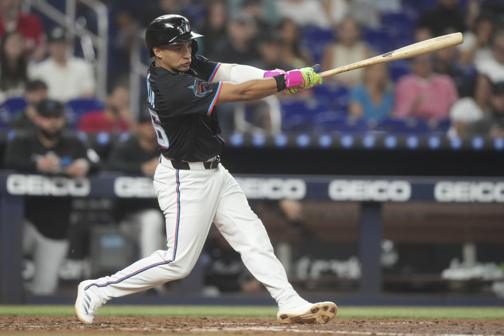 Miami Marlins' Javier Sanoja hits a home run during the second inning of a baseball game against the Toronto Blue Jays, Friday, Aug. 22, 2025, in Miami. (AP Photo/Marta Lavandier)