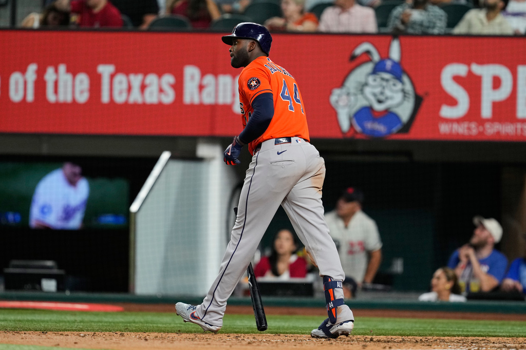 Houston Astros' Yordan Alvarez walks out of the batters box watching the flight of his solo home run in the eighth inning of a baseball game against the Texas Rangers Wednesday, May 27, 2026, in Arlington, Texas. (AP Photo/Tony Gutierrez)