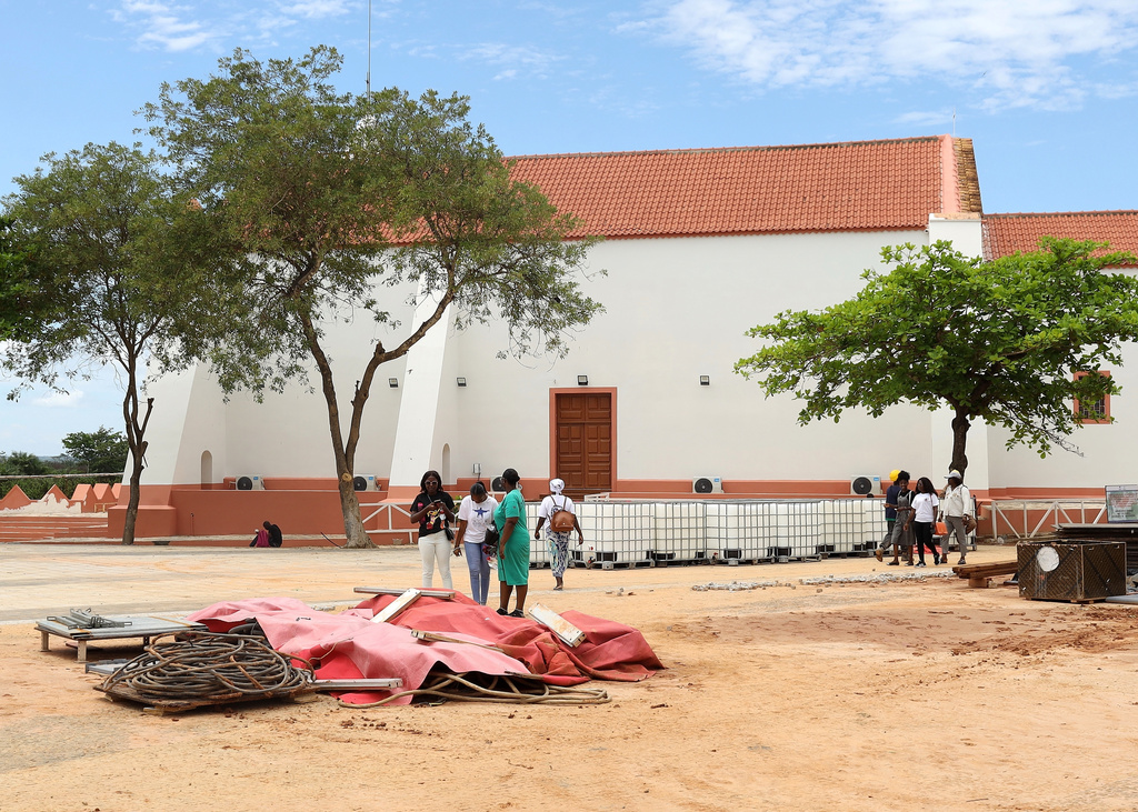 People walk by the Church of Our Lady of Muxima in Muxima, Angola, Saturday, April 11, 2026 which Pope Leo XIV will visit during his 11-day pastoral visit to Africa. (AP Photo)