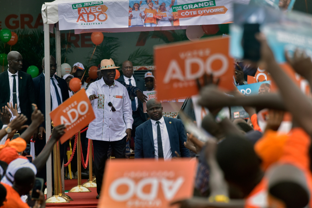 President Alassane Ouattara addresses supporters during a campaign rally at the Félix Houphouët-Boigny Stadium in Abidjan, Ivory Coast, Saturday, Oct. 18, 2025. (AP Photo/Diomande Ble Blonde)